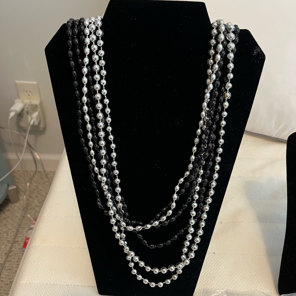3 black and 3 silver plastic bead necklaces